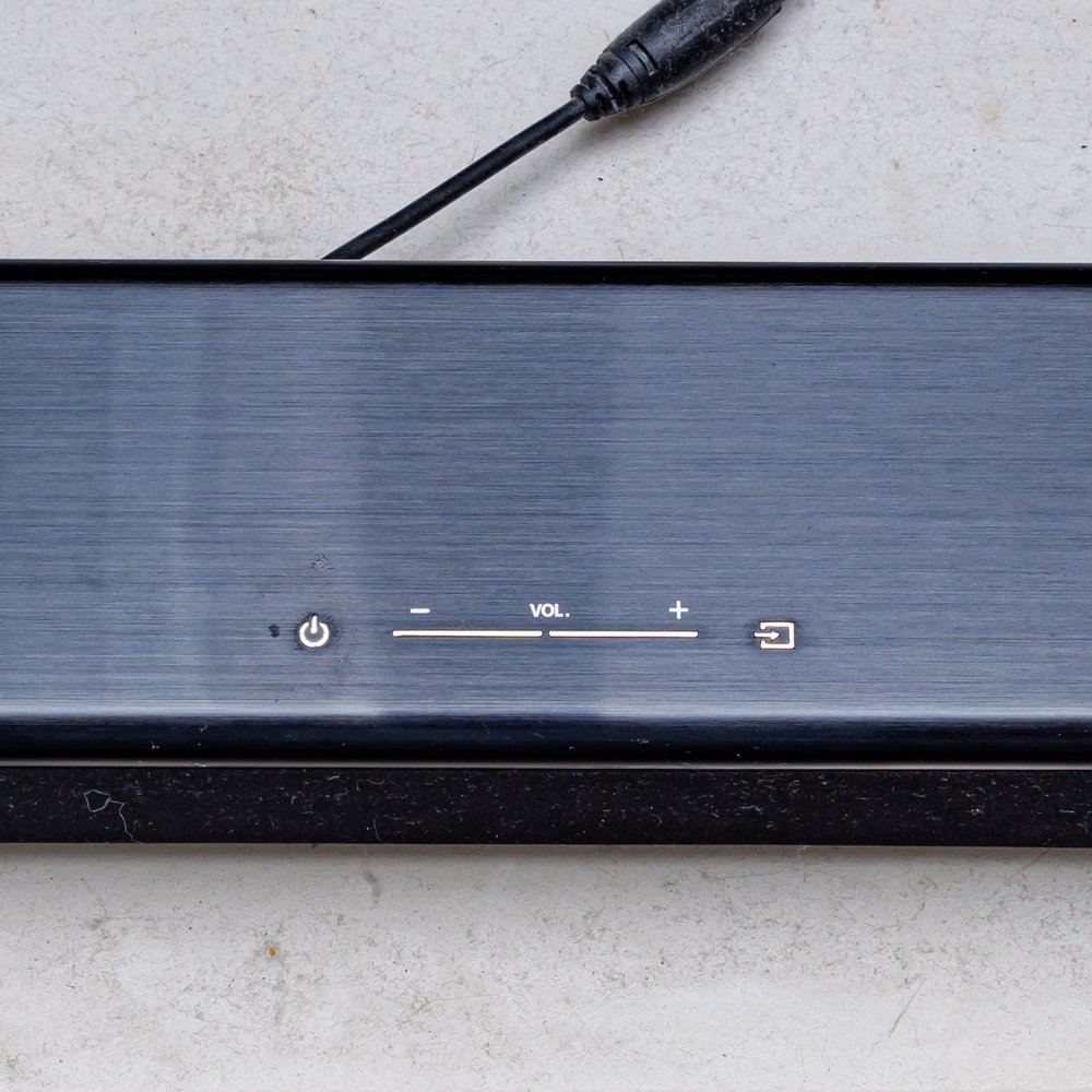 Barra de sonido 2.1 con subwoofer, caja abierta